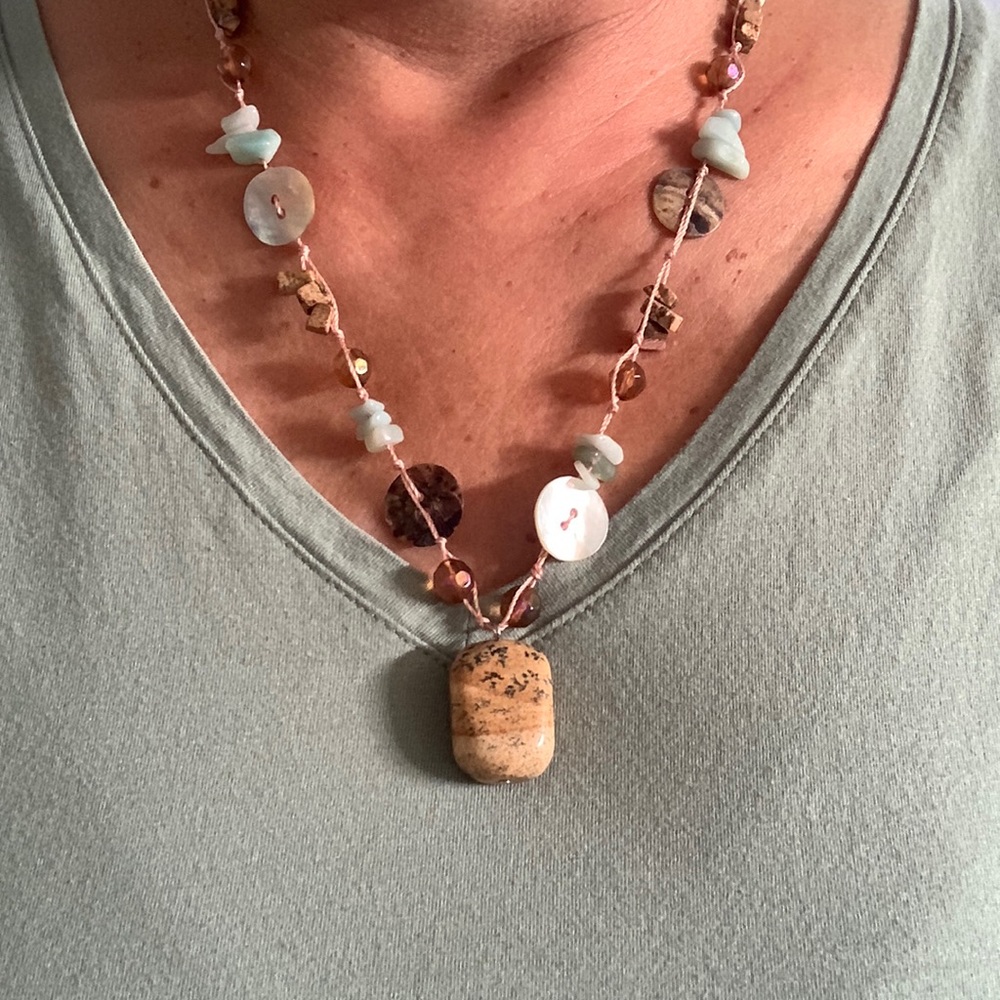 Tropical style necklace Buttons,turquoise stones, and brown beads.